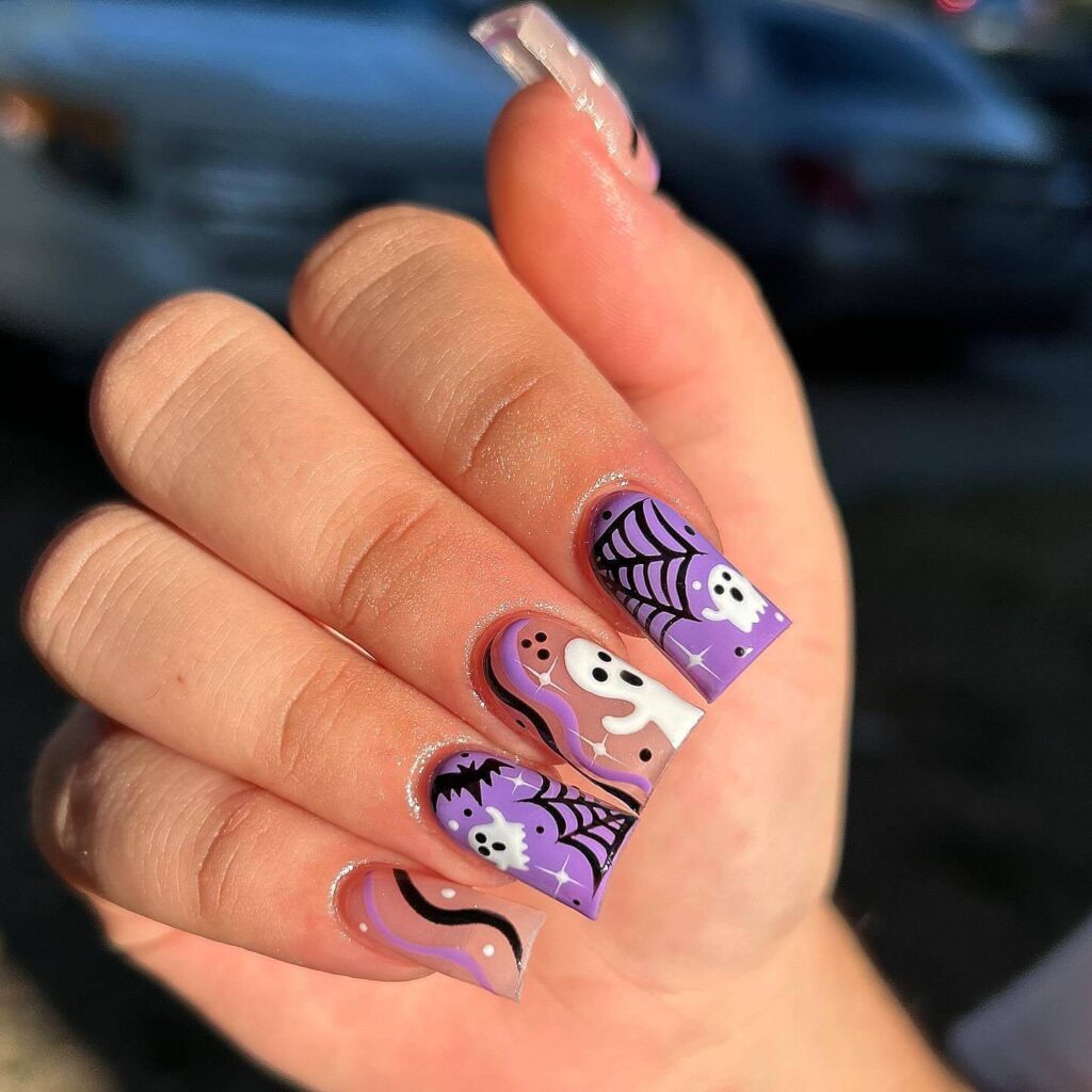 Purple polish with white ghost and Webs, creepy, cute nail design