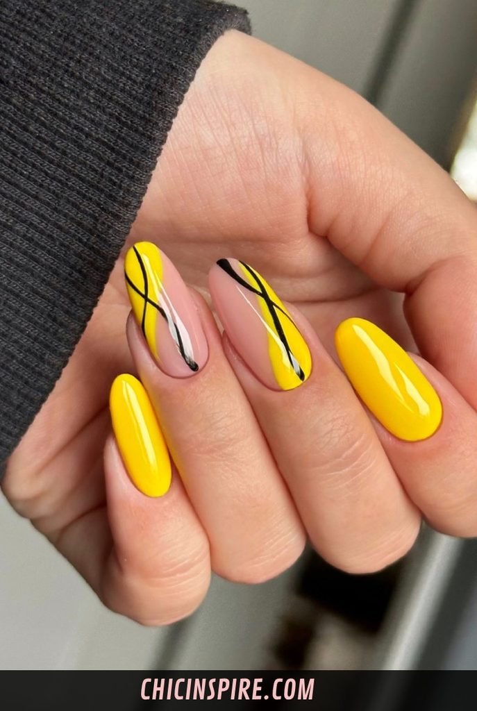 13. Yellow and Black Nails
