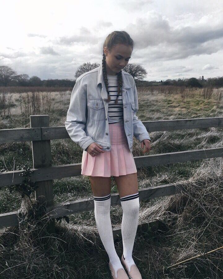 Jeans Jacket, White, and Black Stripe Blouse, Pink Tennis Skirt, White Long Socks, and Sneakers. 