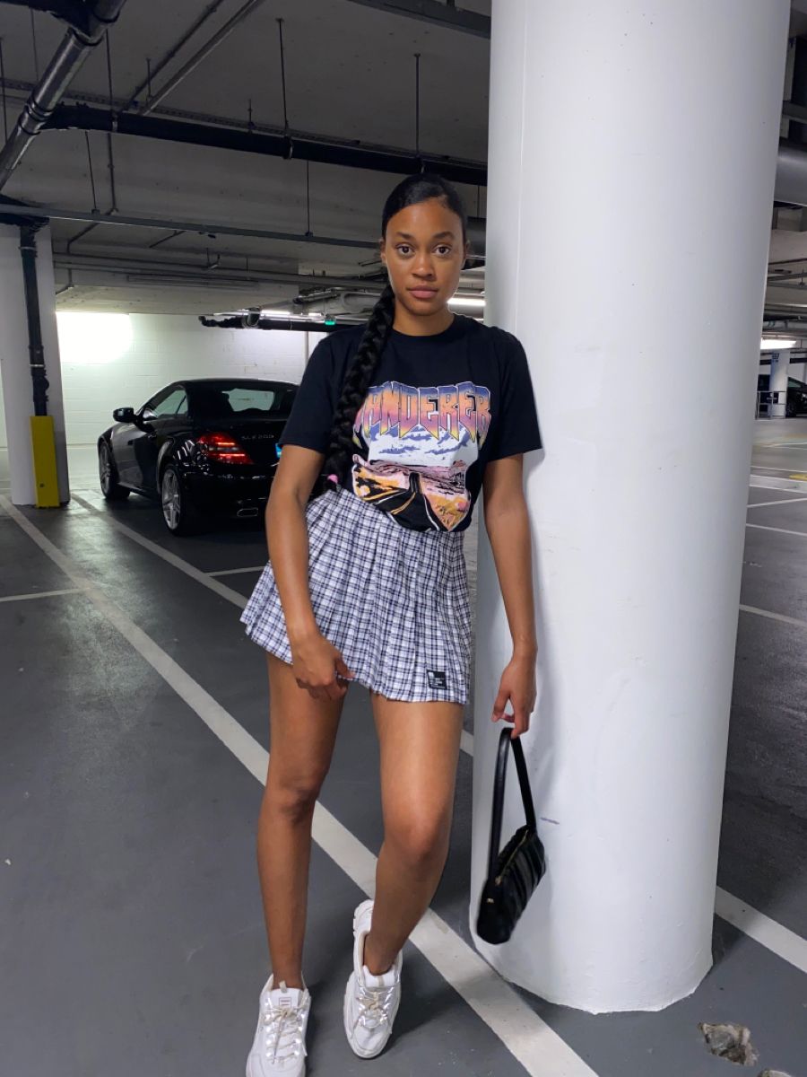 Plaid Tennis Skirt Outfit with Black T-Shirt, Sneakers and Handbag