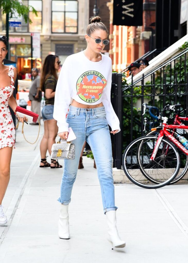 Long Sleeve Crop top White Top with Blue Fitted jeans and Ankle Boots