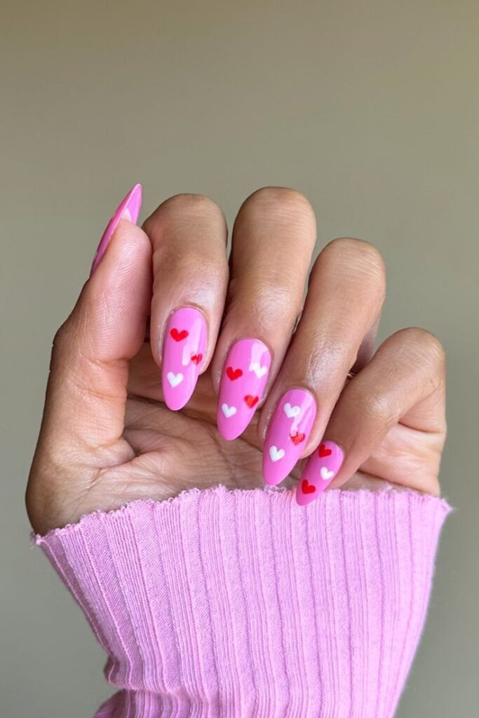 Red and white tiny heart with pink polish Valentines Day Heart Nails Designs