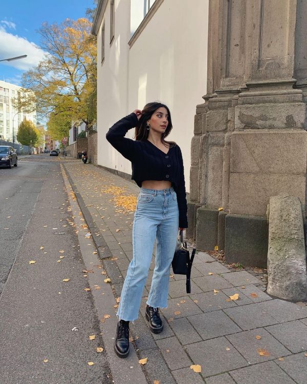 A beige cropped sweater and high-waist pants paired with sleek ankle boots make a minimal yet bold statement. It’s effortlessly chic for day-to-night transitions.