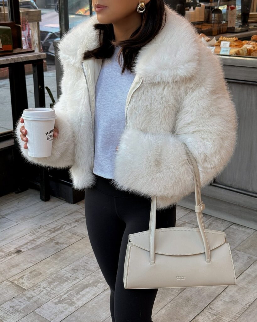 NYC Winter Outfits Looks and Styles 35 NYC Winter Outfits - Let's have a fun and exciting Winter this season. New York City in the winter is a magical yet merciless experience. White Fur Jacket with Black Winter Leggings, Cute and Simple