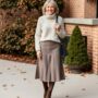 A midi skirt with a cozy sweater and booties for over 50 woman Winter Outfit for Women Over 50 A Guide to Style and Comfort