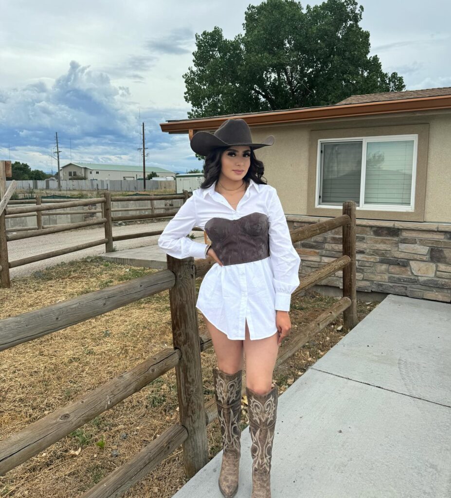 Modern Cowgirl Outfit Inspo White Shirt Dress with corest, hat, and brown cowgirl boots
