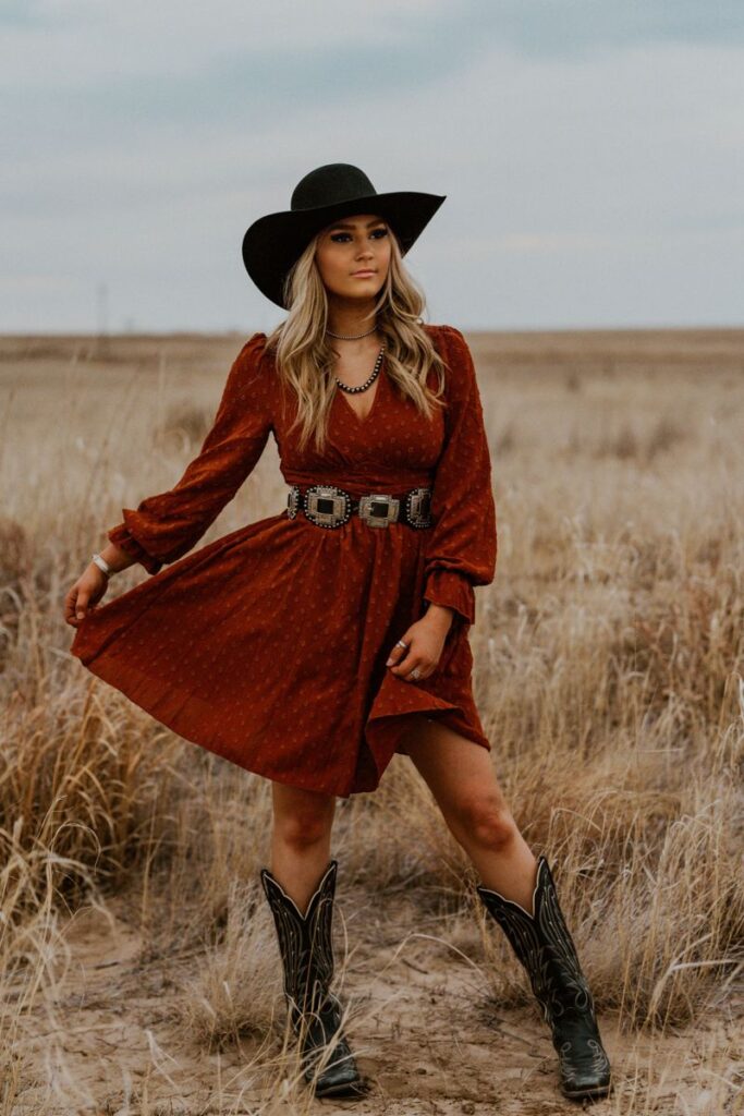 cowgirl Holiday Western, Red plaid shirt dress, brown leather boots, antler earrings, cozy poncho