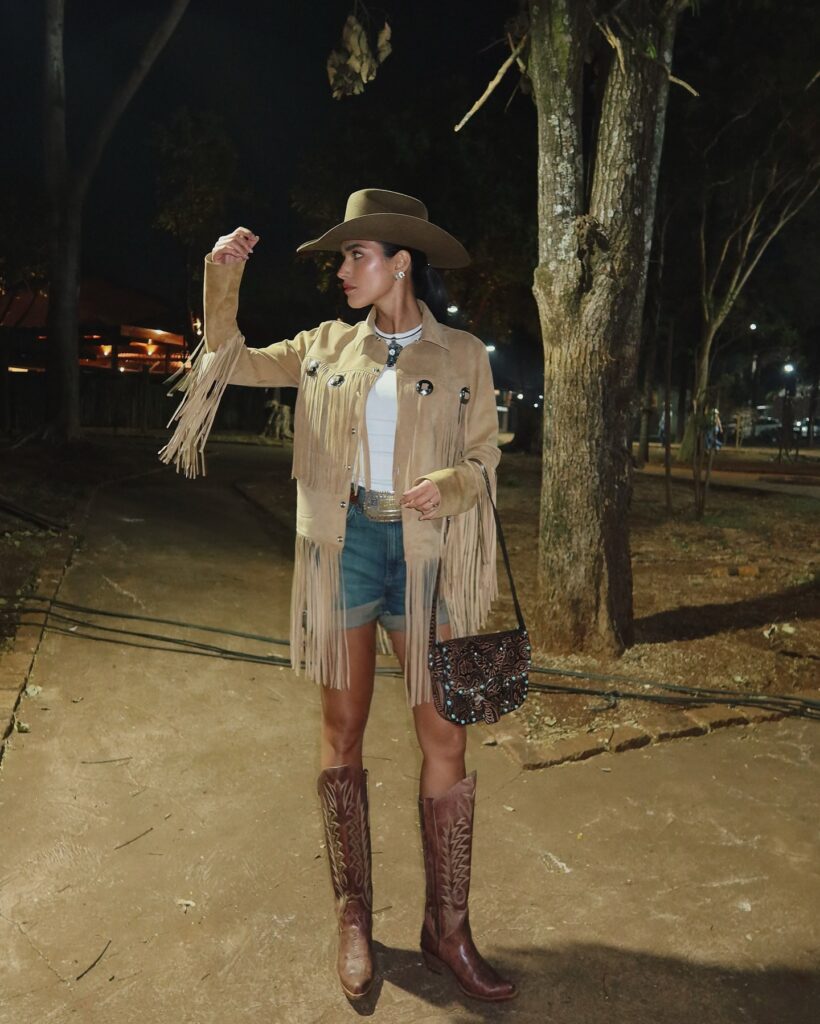 The Vest Look, Simple long-sleeve tee, suede fringe vest, jeans shorts, brown boots.