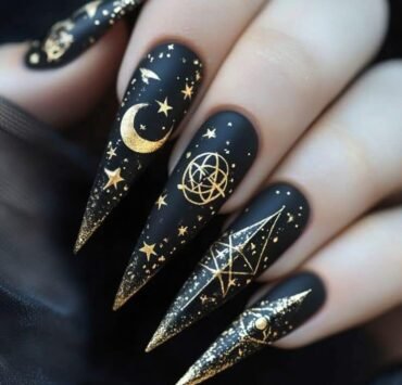 Black with gold celestial symbols serpents moons all seeing eyes Fun Witchy Nail Designs for Halloween