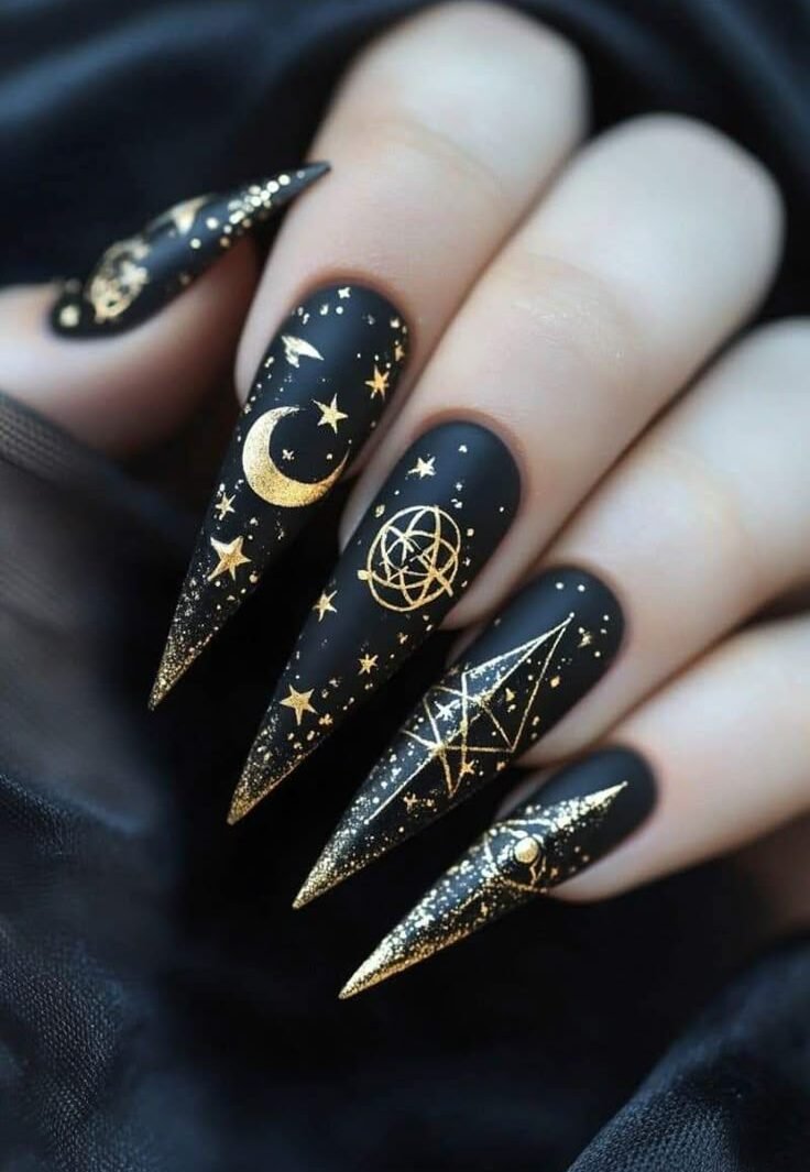 Black with gold celestial symbols serpents moons all seeing eyes Fun Witchy Nail Designs for Halloween