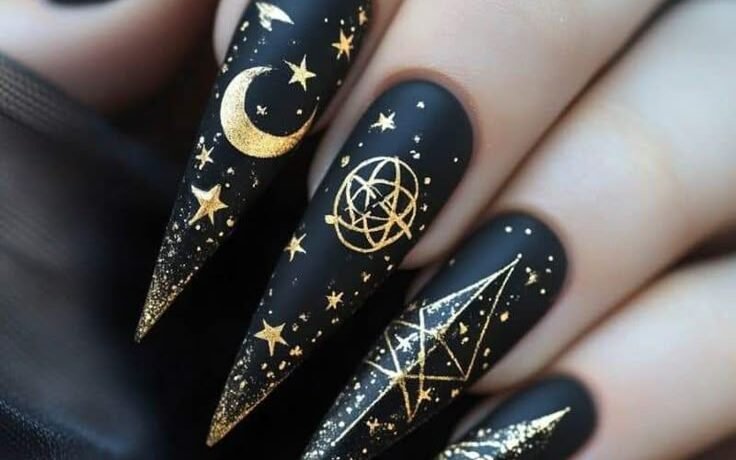 Black with gold celestial symbols serpents moons all seeing eyes Fun Witchy Nail Designs for Halloween