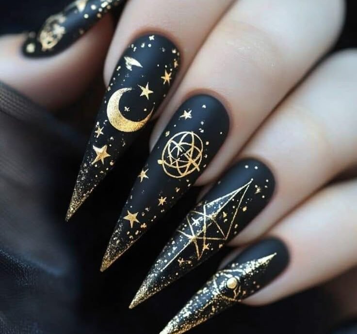 Black with gold celestial symbols serpents moons all seeing eyes Fun Witchy Nail Designs for Halloween