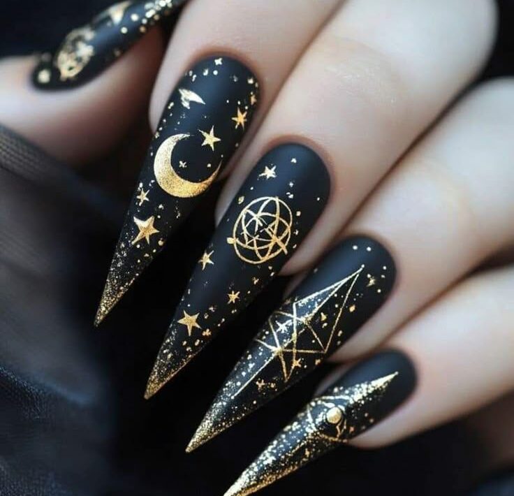 Black with gold celestial symbols serpents moons all seeing eyes Fun Witchy Nail Designs for Halloween