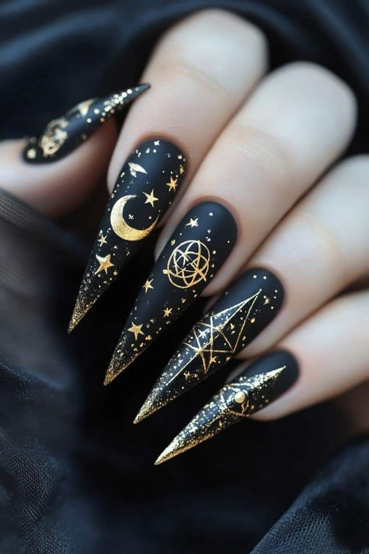 Black with gold celestial symbols serpents moons all seeing eyes Fun Witchy Nail Designs for Halloween