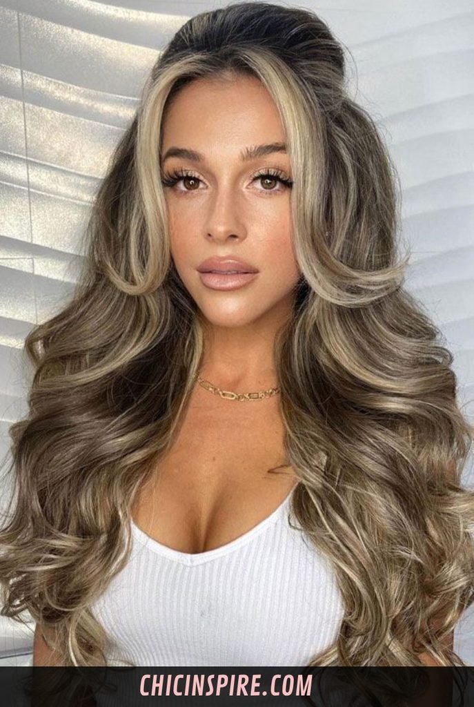 Half-Up Hairstyle with Curtain Bangs.