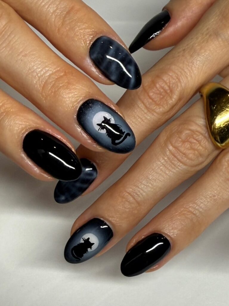 witchy nails design Black cat silhouettes with glossy accents