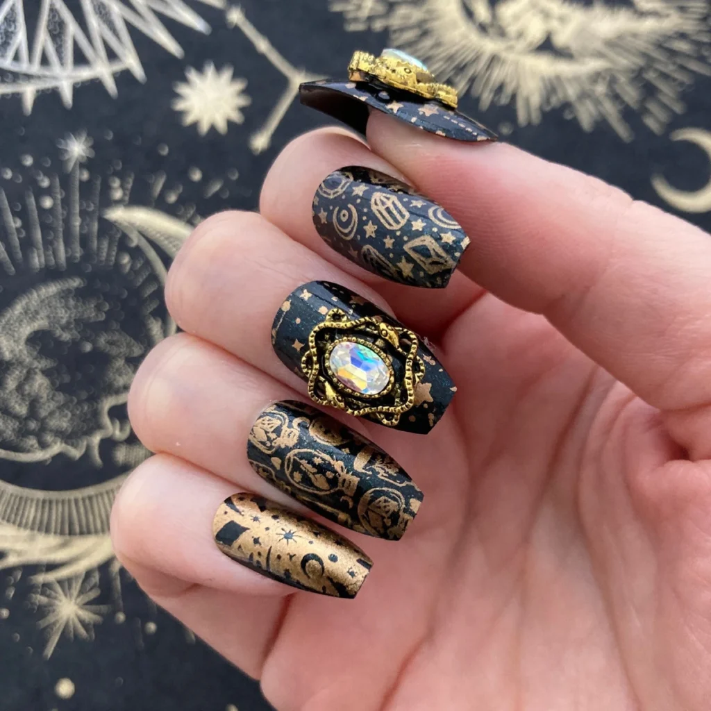 witchy nails design Black with gold sparkles (simple celestial vibe)